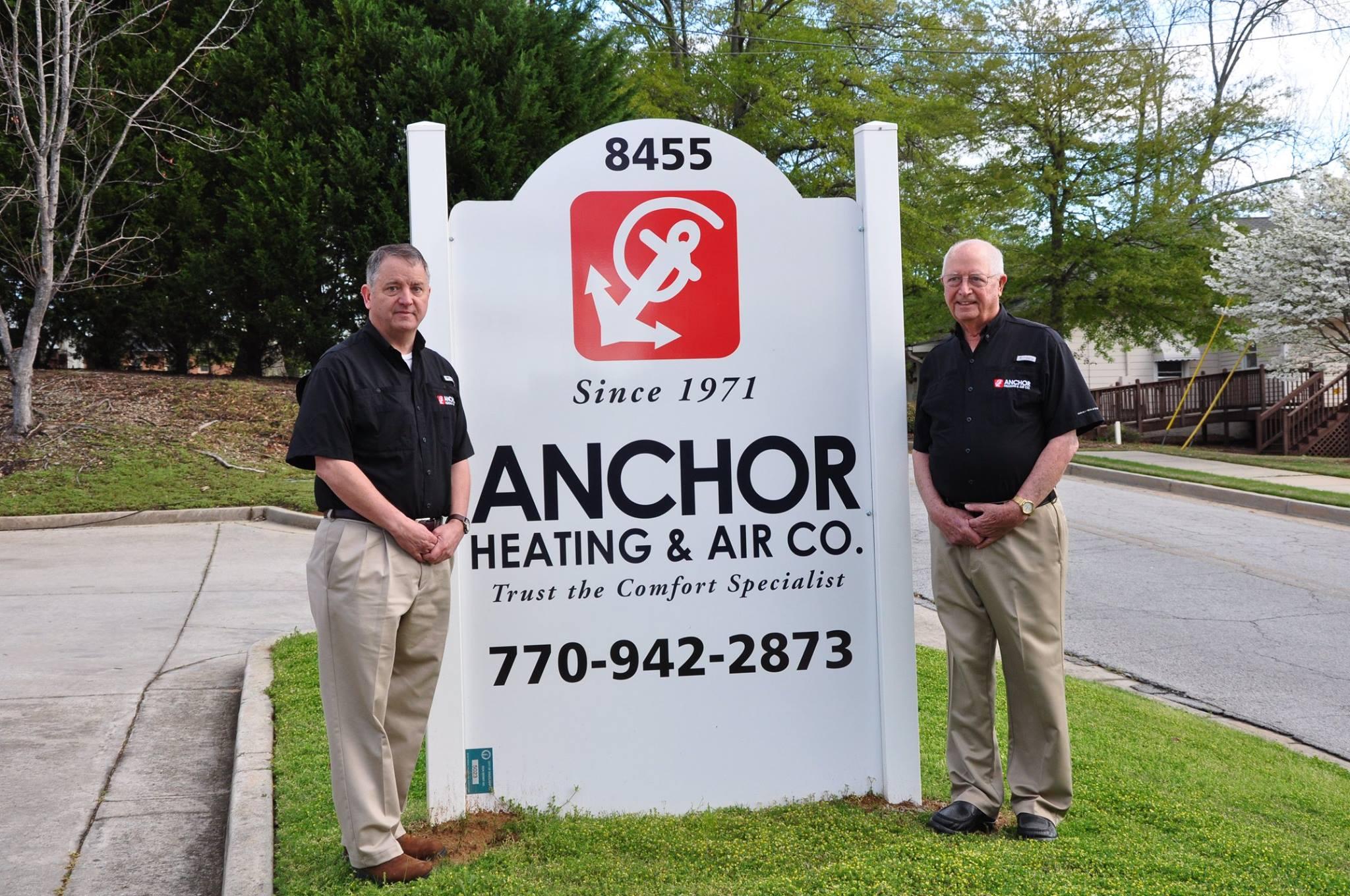 Jack and Barry Standing Next to Anchor AC Sign