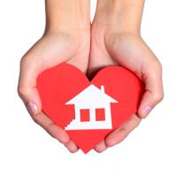 hands holding heart and house, dream home