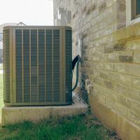 hvac outdoor unit attached to a house