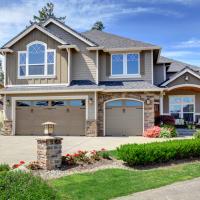 two story home with landscaping