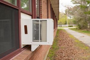 window unit on a brick home