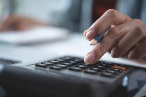 Woman using their calculator