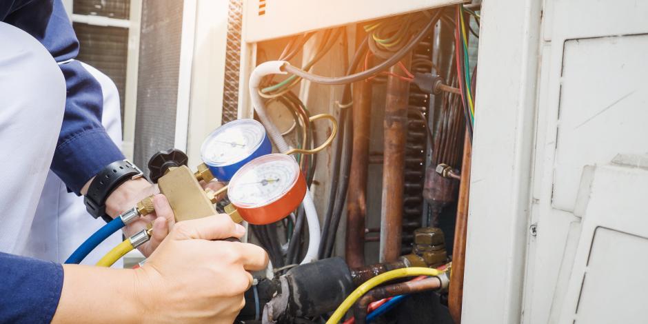 technician checking air conditioner