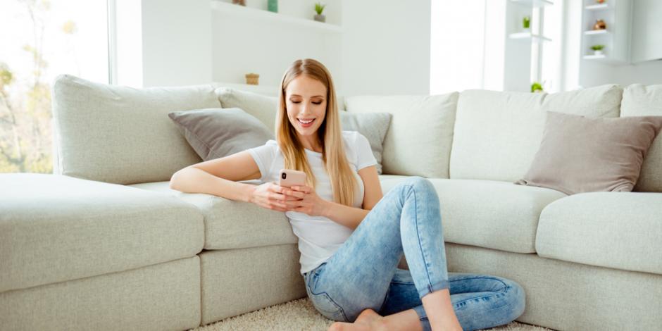 comfortable woman on phone at home