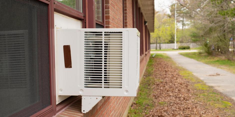window unit on a brick home