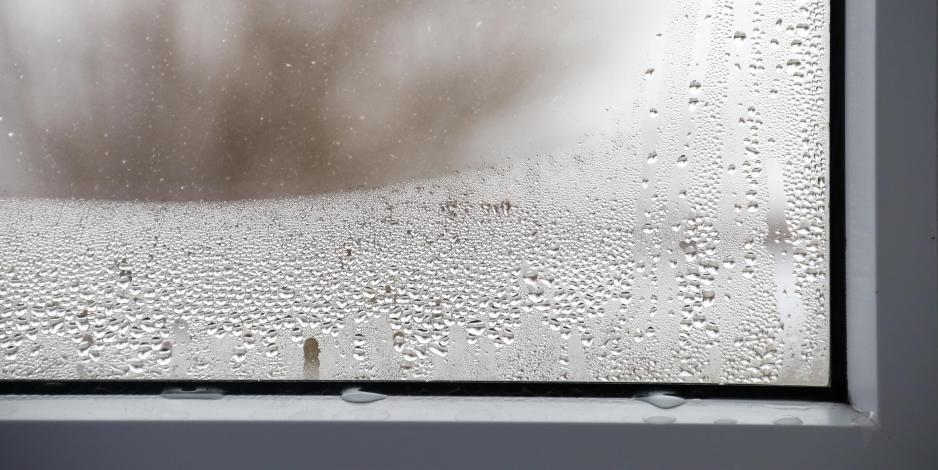 Water droplets on home window from indoor humidity Water droplets on home window from indoor humidity