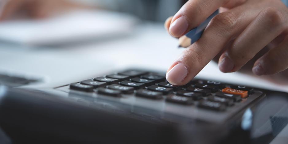 Woman using their calculator