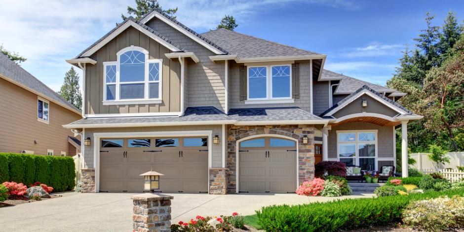 two story home with landscaping