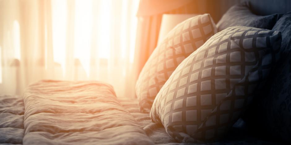 sunlight coming through windows into bedroom