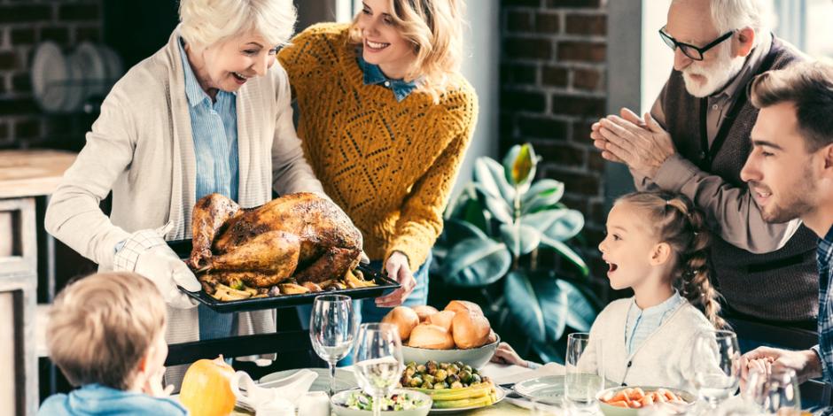 family gathered around the table for a turkey dinner